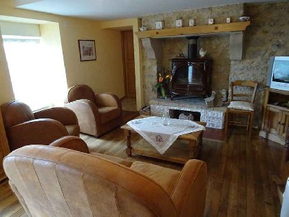 Pièce à vivre - coin salon, Propriétaire du gîte